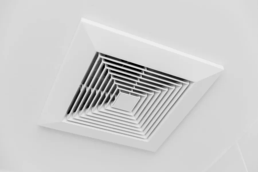 Clean ceiling air duct and ventilation grille in a well-maintained property
