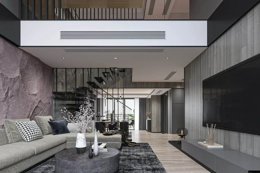 Renovated open-plan interior with exposed brick and a fitted kitchen