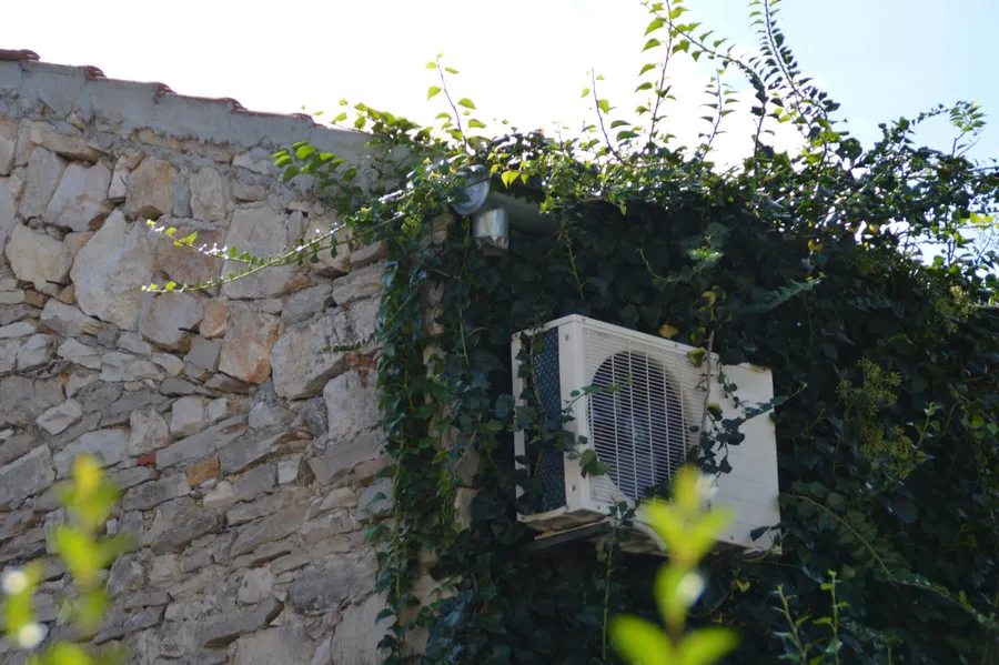 Exterior of a renovated French residential property with garden